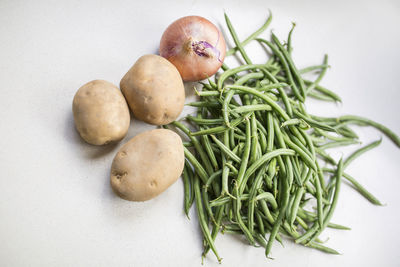 Close-up of vegetables on table against white background