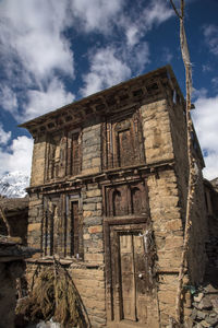 Low angle view of old building against sky