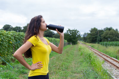 Young woman photographing with camera