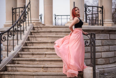 Full length of woman on staircase