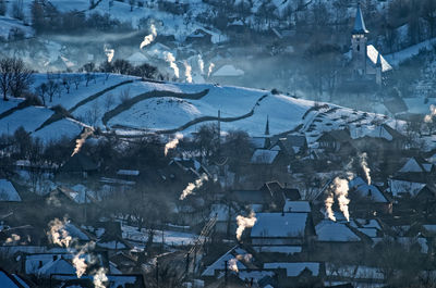 High angle view of birds flying over sea during winter