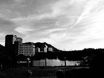 Buildings against cloudy sky