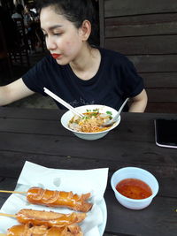 Close-up of man eating food