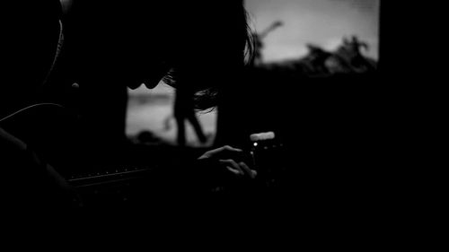 Silhouette person photographing through smart phone