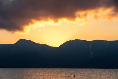 Scenic view of lake against sky during sunset