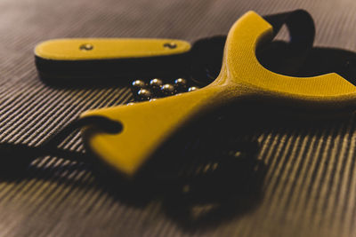Close-up of guitar on table