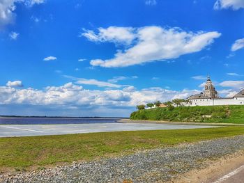 View of beach against cloudy sky