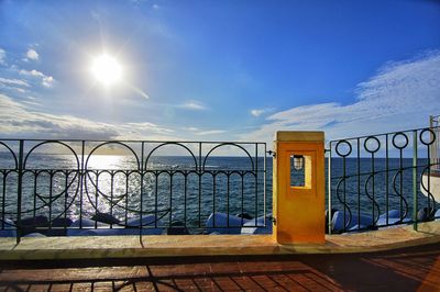 Built structure by sea against blue sky