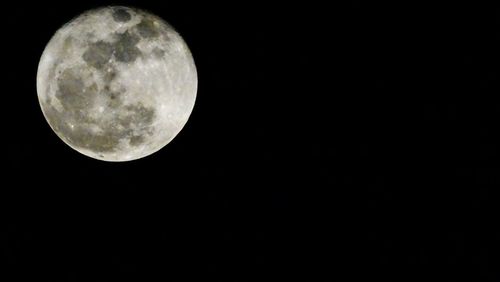 Scenic view of moon against clear sky at night