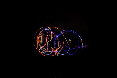 Close-up of light painting against black background