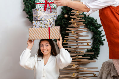 Portrait of woman with christmas tree