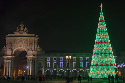 Christmas tree on commerce square at night in lisbon