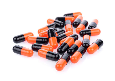 Close-up of capsules against white background