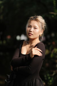 Portrait of young woman looking away