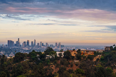 High angle view of buildings against sky during sunset