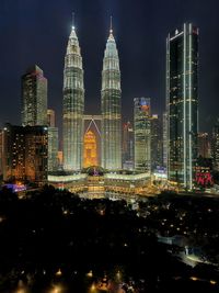 Illuminated buildings in city at night