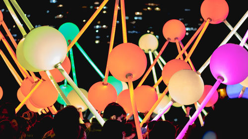 Group of people balloons at night