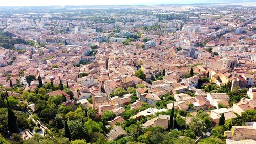 High angle view of townscape and trees in town