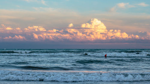 Scenic view of calm sea at sunset