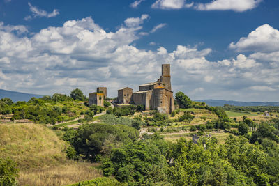 View of trees and buildings against sky