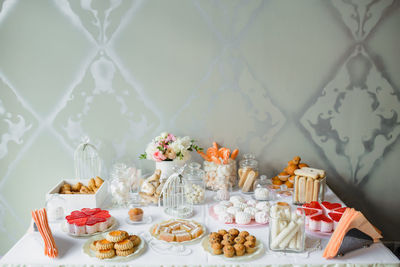 A delightful wedding reception, a candy bar, a dessert table filled with cakes and sweets
