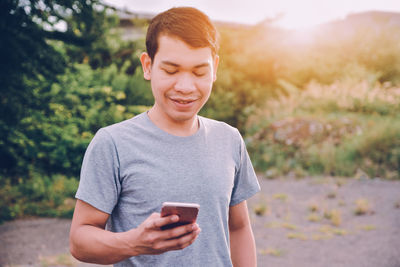 Mid adult man using smart phone