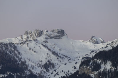 Scenic view of snowcapped mountains against clear sky