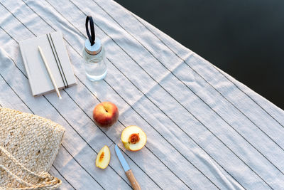 Summer picnic by the lake at sunset.