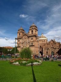 View of the cathedral of cusco and the gardens of the square in a sunny day with clear skies