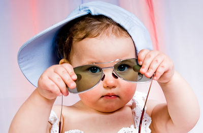 Close-up of young woman wearing sunglasses