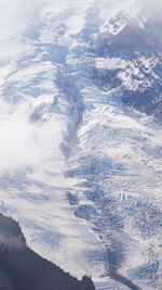 High angle view of snowcapped mountain against sky