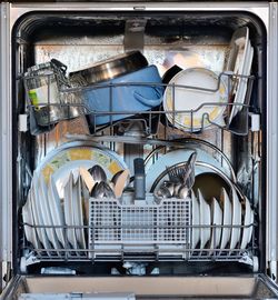 Utensils in dishwasher at home