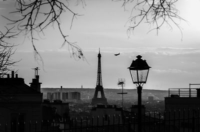 Silhouette of city against sky
