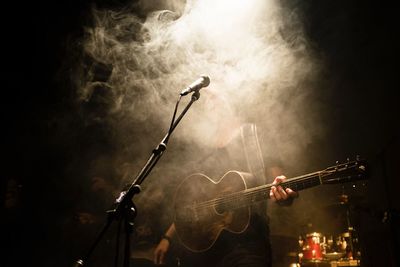 Guitarist performing at music concert