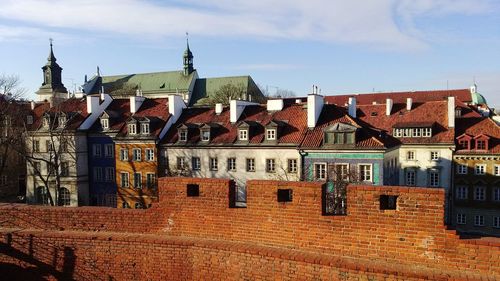 Houses against sky in city