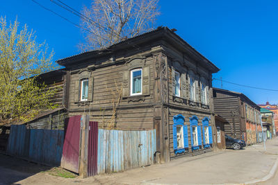 Exterior of old building against clear blue sky