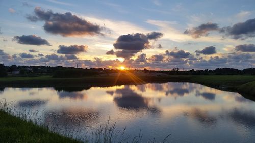 Scenic view of lake at sunset