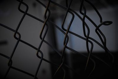 Full frame shot of metal fence against sky