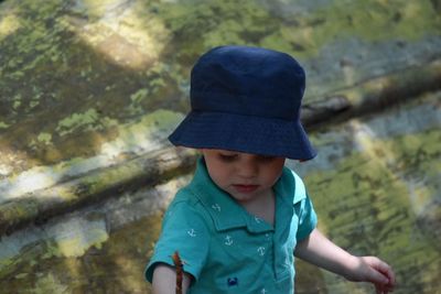 High angle view of cute boy standing on land