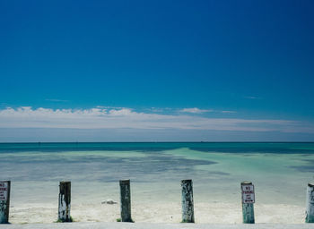 Scenic view of sea against blue sky