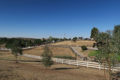 High angle view of road against clear blue sky
