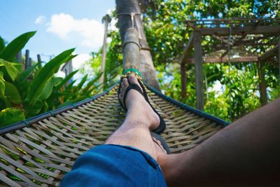 Low section of man wearing shoes