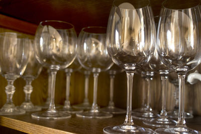 Close-up of wine glasses on table