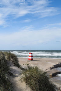 Scenic view of beach against sky