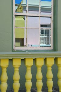 Reflection of yellow windows on window