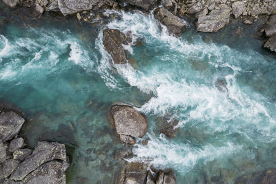 Scenic turquoise and crystal clear water in the vestland county norway river. 