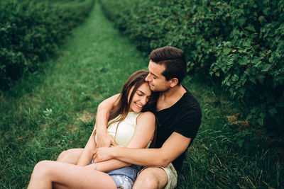 Young couple sitting on land