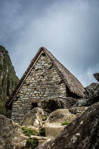 Low angle view of old ruin against sky