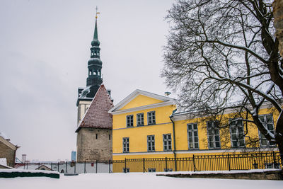 Building against sky during winter