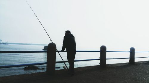 Man fishing in sea